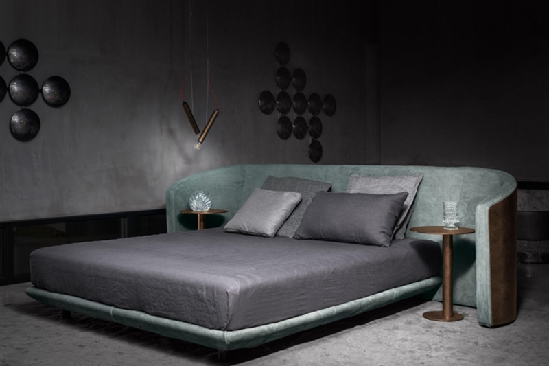 Curved silhouettes and plush textures create a sanctuary of serene slumber